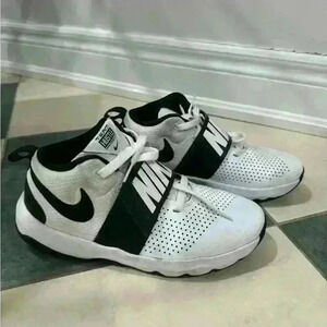 Black and  white Nike sneakers in size US 6Y